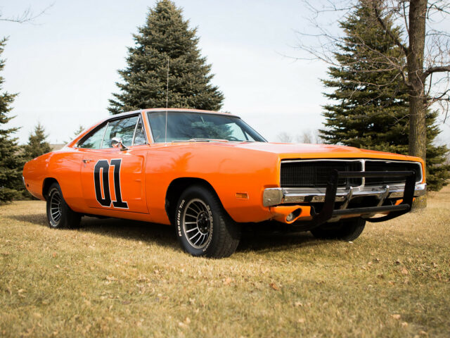 Classic Orange General Lee Car with Number 01 on Grass Field Wallpaper