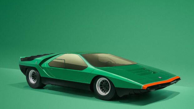 A sleek green Alfa Romeo car is displayed with a unique aerodynamic shape against a matching green background