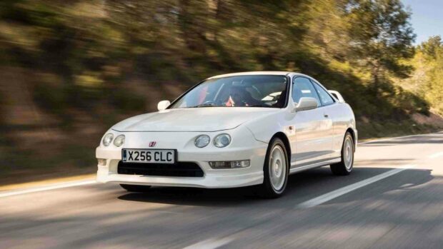 A white Honda Integra is speeding along a forest road with motion blur in the background, HD Desktop Wallpaper