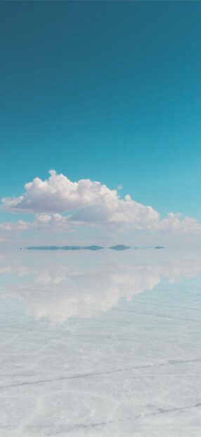 A stunning view of the Bolivian salt flats with clouds reflecting on the surface, HD Phone Wallpaper