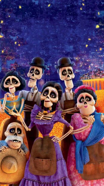 The Coco cartoon characters are posing together in vibrant traditional outfits under a night sky, 2K Mobile Wallpaper