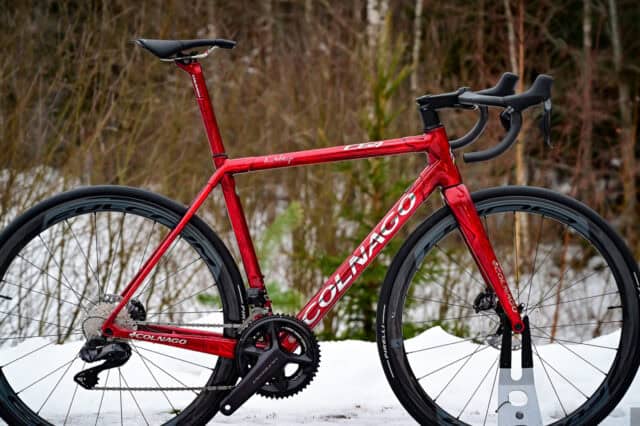 Colnago C64 Red Road Bike with Carbon Wheels in Snowy Outdoor Setting