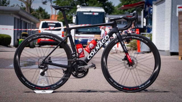 Colnago Road Bike with UAE Team Bottles in Outdoor Setting Colnago Wallpapers