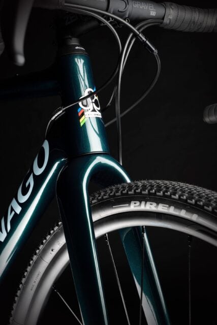 Colnago Wallpapers Close Up of Dark Green Bicycle Frame and Pirelli Tire on Black Background