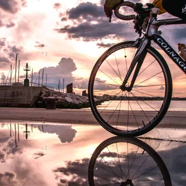 Colnago Wallpapers Road Bike Riding by Waterfront at Sunset with Reflection