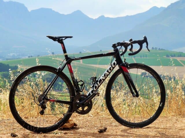 Colnago road bike on scenic mountain trail high quality Colnago wallpapers