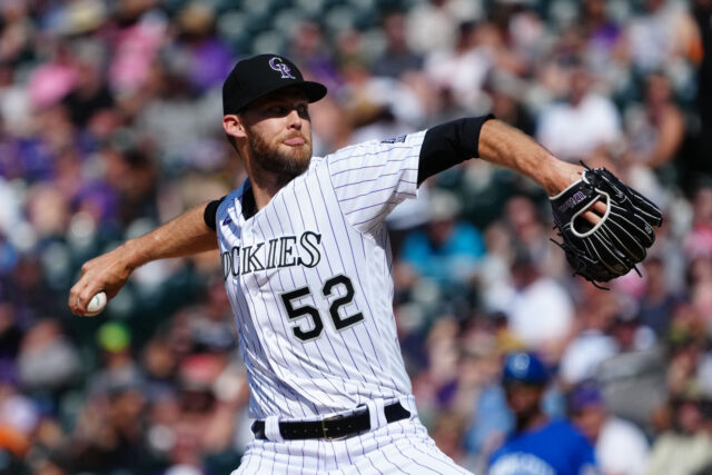 Colorado Rockies Baseball Player Pitching in Game Action Wallpaper