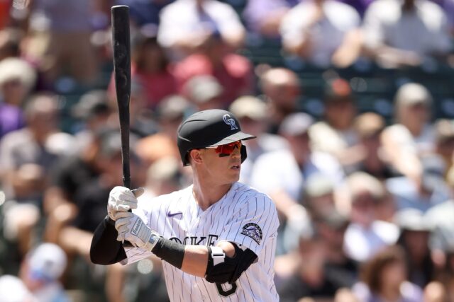 Colorado Rockies Baseball Player Ready to Bat in Action Packed Game Wallpaper