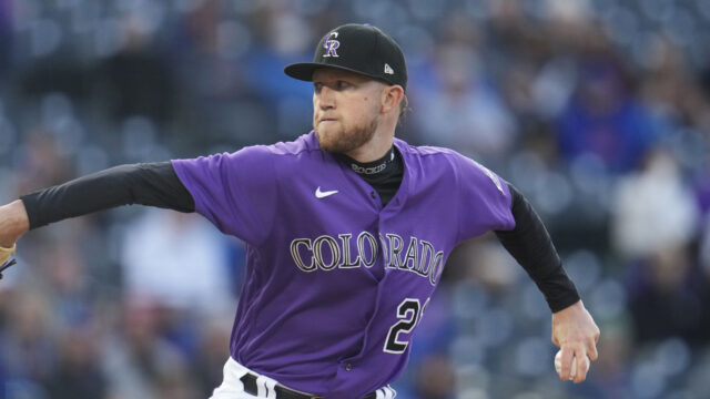 Colorado Rockies Pitcher Throwing Baseball in Action Wallpaper