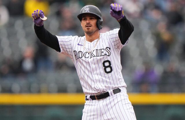 Colorado Rockies Player Celebrates on Field During Baseball Game Wallpapers