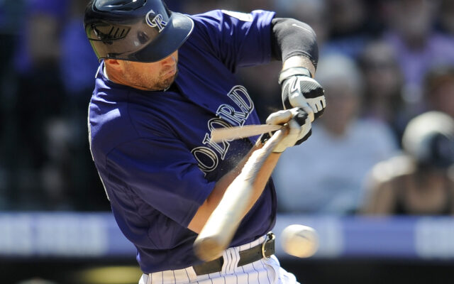 Colorado Rockies Player Hitting Baseball Close Up Action Wallpaper