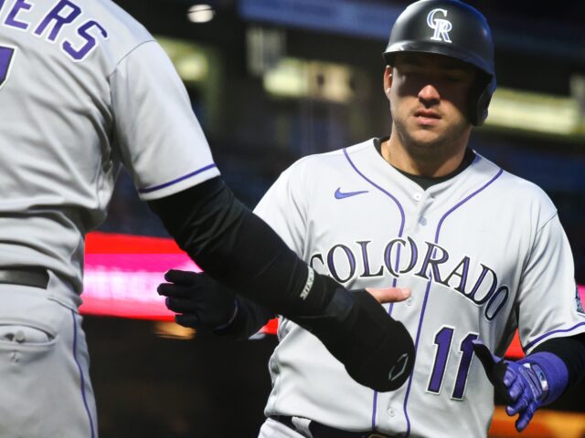 Colorado Rockies Players Celebrating During Baseball Game Wallpaper