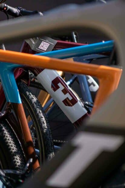 A close up view of colorful 3T bike frames and tires, HD Mobile Wallpaper