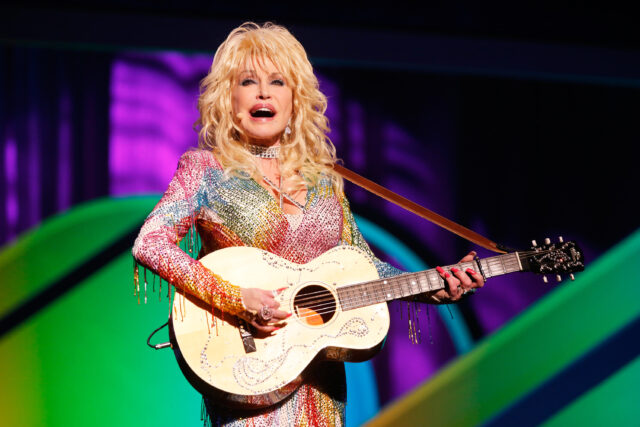 Colorful Stage Performance By Dolly Parton In Concert Wallpaper