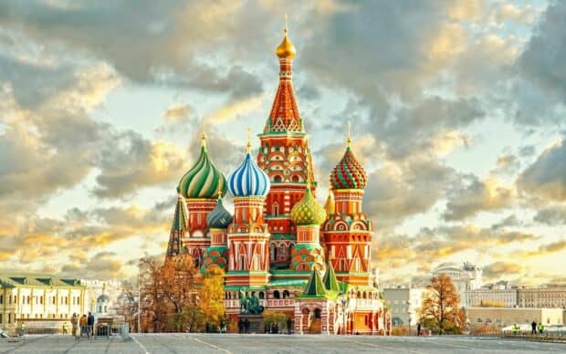 A colorful cathedral with unique towers stands against a cloudy sky, 2K Desktop Wallpaper