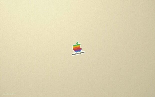 A colorful retro Imac logo is centered on a textured beige surface, HD Desktop Wallpaper