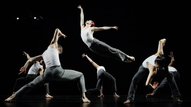 Contemporary Dance Wallpapers Dynamic Group Performance on Dark Stage