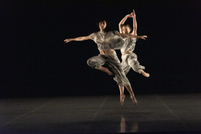Contemporary Dance Wallpapers Featuring Two Artists Performing Dynamic Jump on Stage
