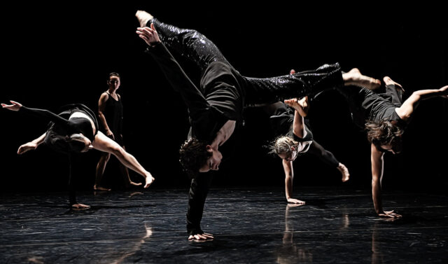 Contemporary Dance Wallpapers Powerful Group Performance in Dynamic Stage Lighting