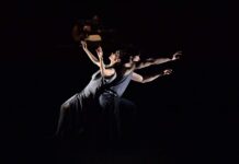 Contemporary dance wallpapers featuring expressive duet performance in dramatic lighting
