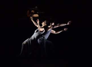 Contemporary dance wallpapers featuring expressive duet performance in dramatic lighting