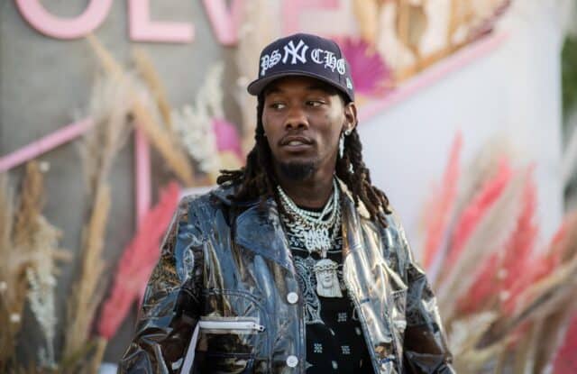 Cool Offset Rapper Wallpaper in Stylish Jacket and Cap with Chains Background