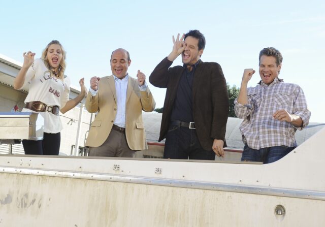 Cougar Town Cast Celebrating On A Boat Scene Wallpaper