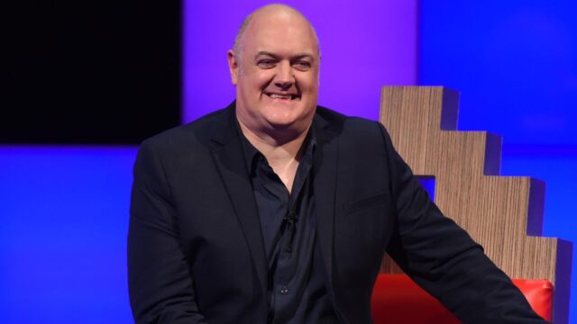 Dara Ó Briain Smiling In Interview Setting Wallpaper