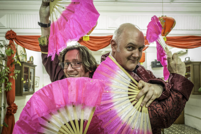 Dara O Briain With Vibrant Fans Colorful Wallpaper