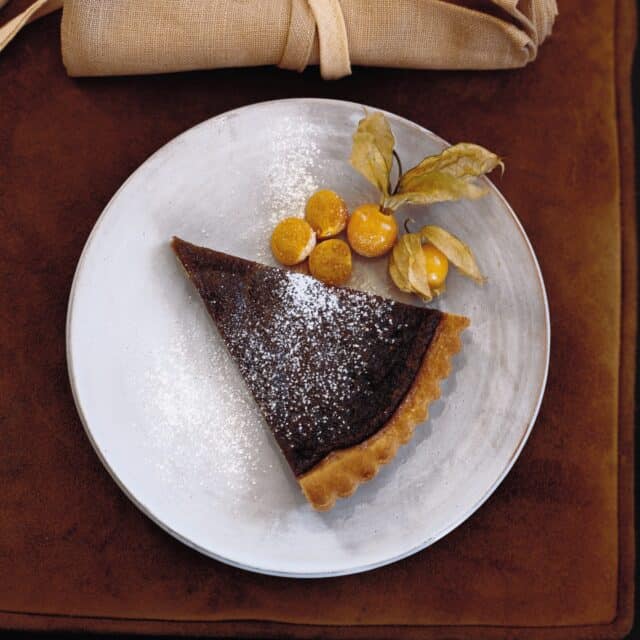 Delicious Chocolate Tart with Powdered Sugar and Fresh Cape Gooseberries Tart Wallpapers