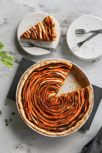 Delicious Vegetable Tart Wallpaper with Spiral Pumpkin and Zucchini Slices on Rustic Plate