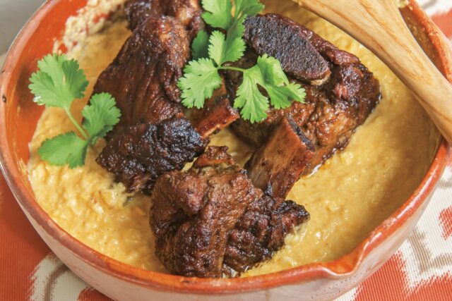 Delicious braised meat with creamy sauce and fresh cilantro garnish Cilantro wallpapers