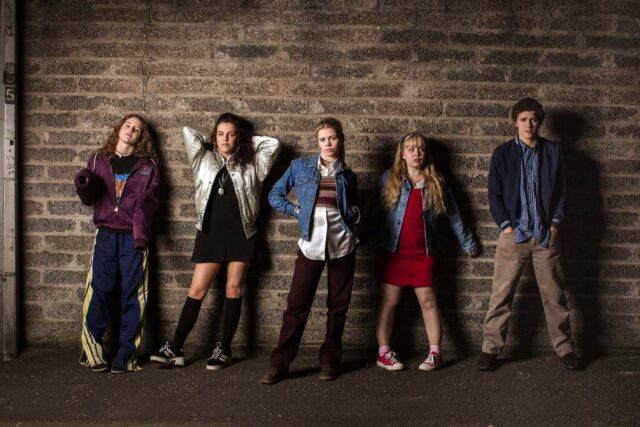 Derry Girls TV Series Characters Standing Against Brick Wall Wallpaper