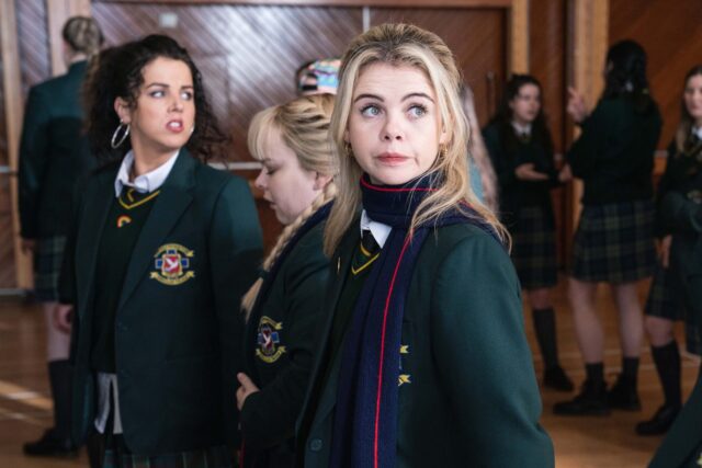 Derry Girls TV Series Wallpaper Featuring School Uniform Scenes and Characters