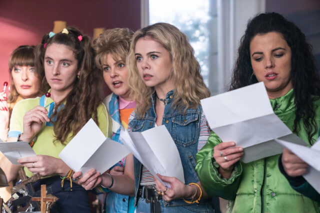 Derry Girls TV Series Wallpaper Group Reading Letters with Surprised Expressions