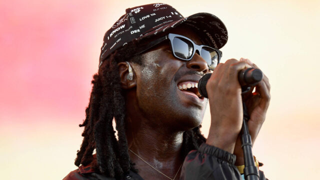 Dev Hynes Live Performance Wallpaper Vibrant Onstage Energy