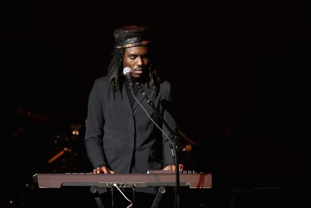 Dev Hynes Performing On Stage Playing Keyboard