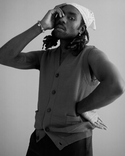 Dev Hynes Stylish Pose Black And White Wallpaper