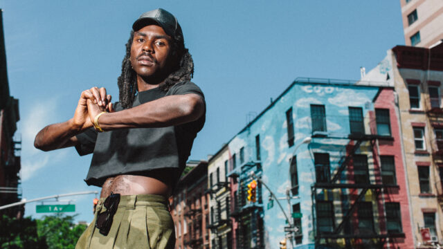 Dev Hynes Urban Portrait Vibrant Cityscape Background