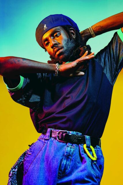Dev Hynes Vibrant Fashion Portrait Wallpaper