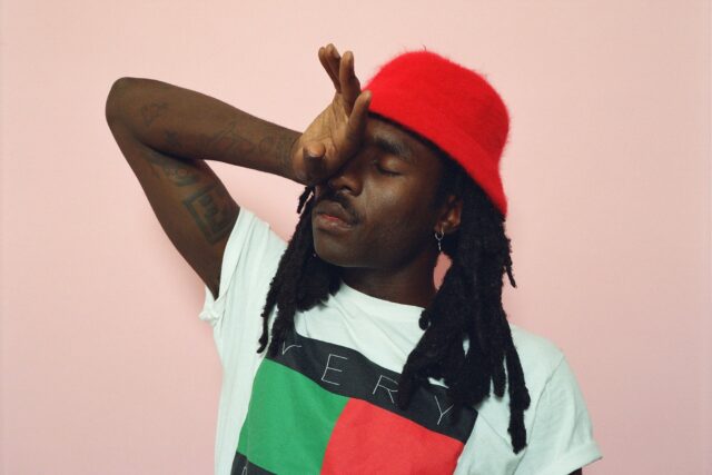 Dev Hynes Wallpaper Calm Expression Red Hat White Shirt