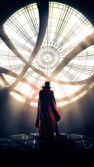 Doctor Strange standing under glowing magical window in mystical sanctuary wallpaper