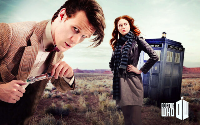 The Doctor played by Matt Smith stands with his companion near the TARDIS in a barren landscape, HD Desktop Wallpaper