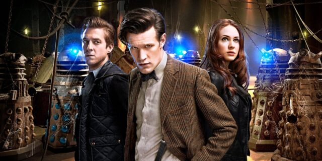The Doctor Who Matt Smith characters are standing together among several Daleks in a dimly lit room, HD Desktop Wallpaper