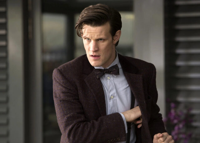 A close up of Matt Smith portraying Doctor Who with a focused look, 2K Desktop Wallpaper