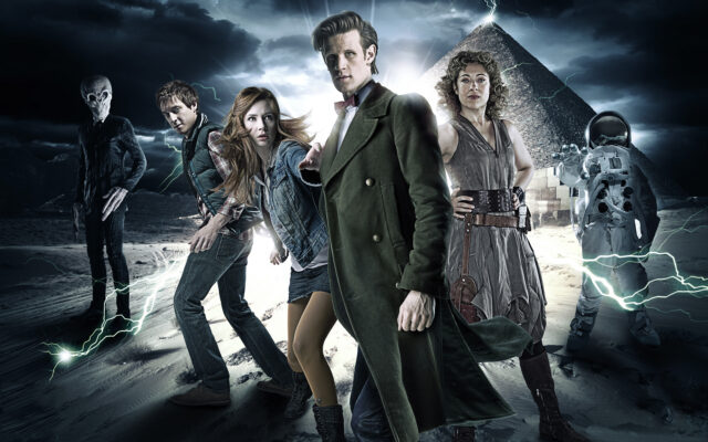 Doctor Who Matt Smith Wallpapers shows the main characters from Doctor Who standing in a dramatic desert scene with a pyramid and lightning, HD Desktop Wallpaper