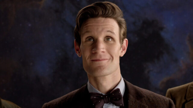 A close up portrait of Doctor Who played by Matt Smith smiling with a starry sky background, HD Desktop Wallpaper