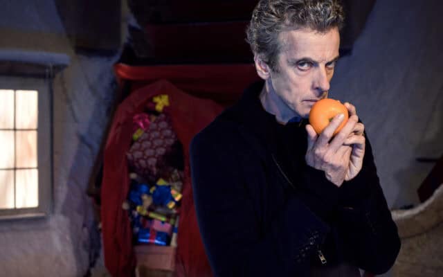 Doctor Who Peter Capaldi Holding Orange Iconic Scene Wallpaper