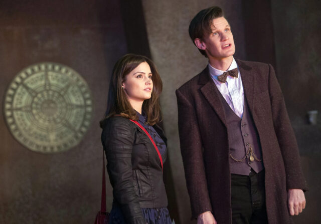 This image shows Doctor Who and his companion standing together in a mysterious setting, 2K Desktop Wallpaper