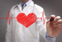 Doctors Hand Drawing Heartbeat Line Wallpaper